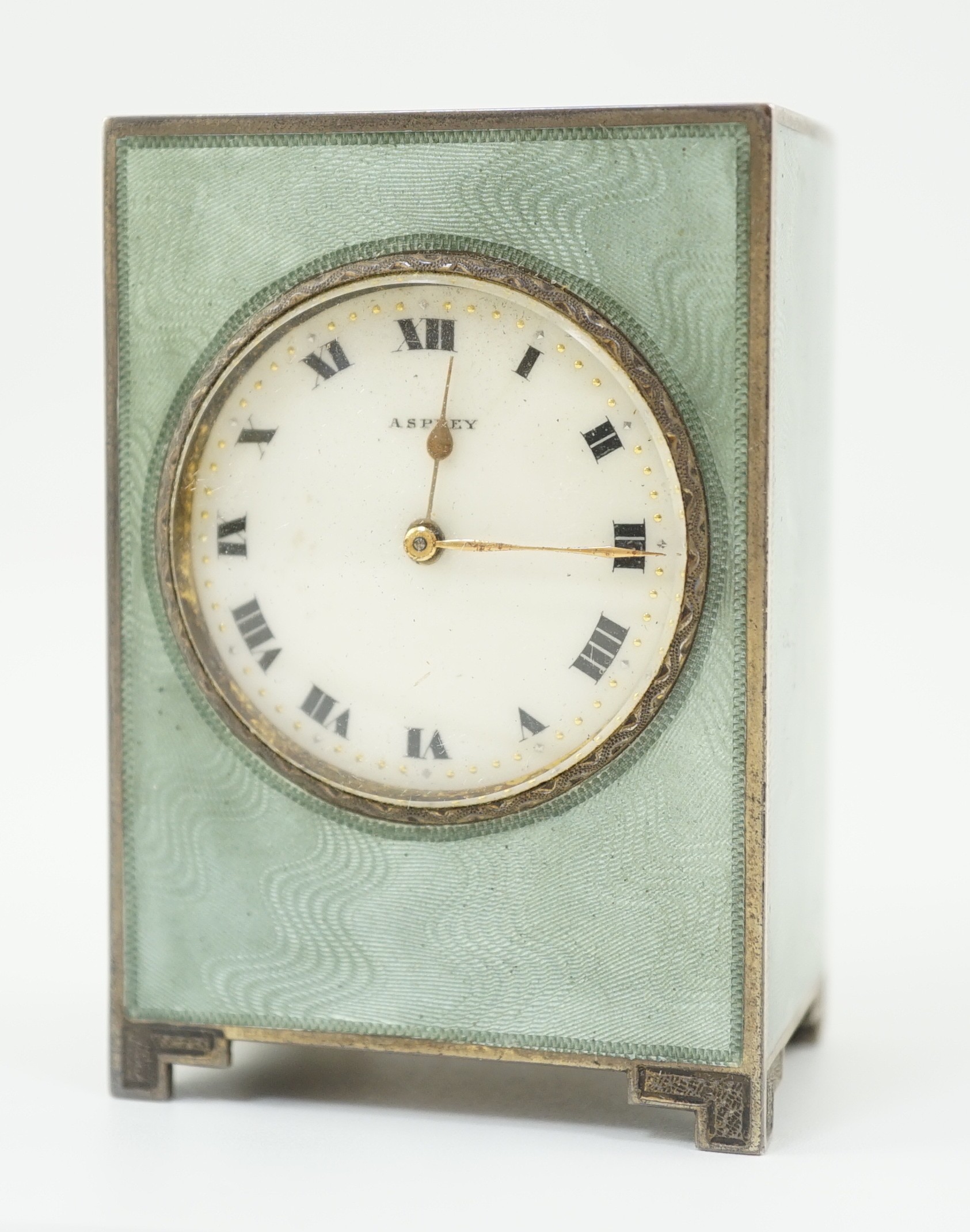 A George V silver and green guilloche enamelled travelling timepiece, retailed by Asprey, in original case